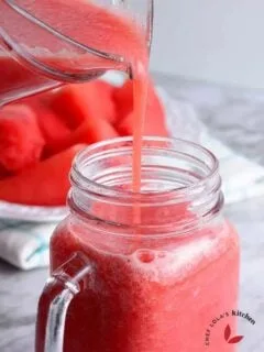 Pouring the freshly made watermelon Juice into a cup