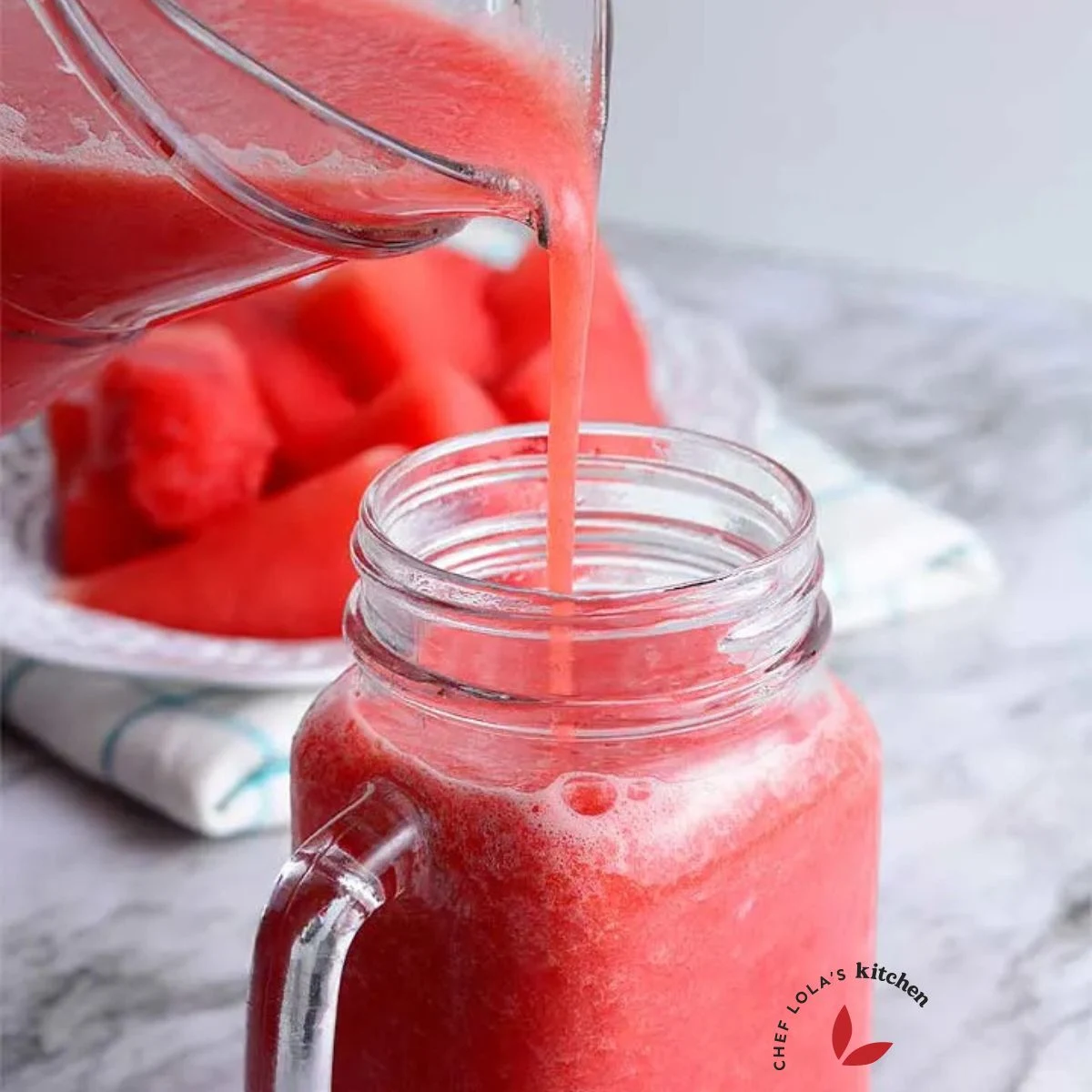 Pouring the freshly made watermelon Juice into a cup