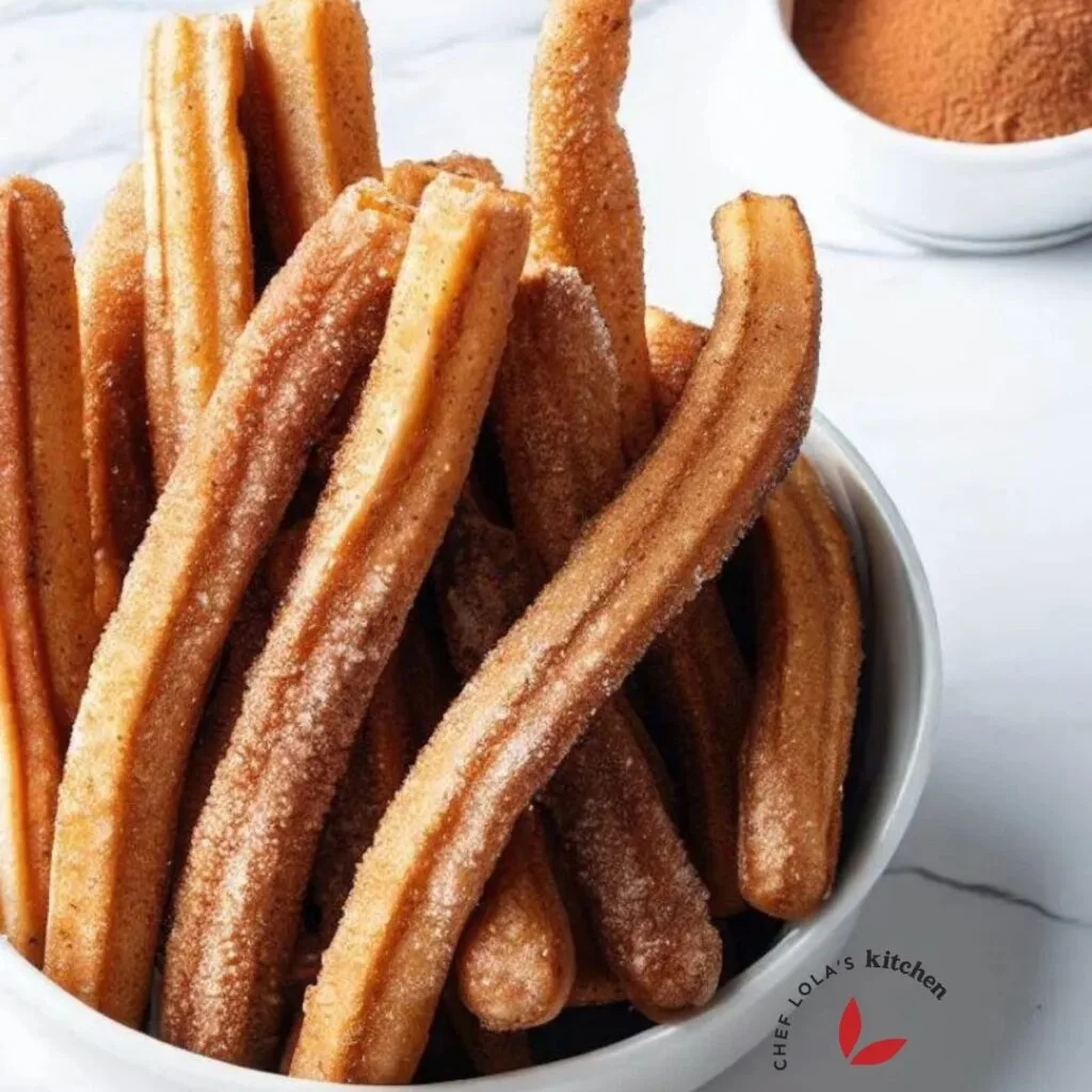 Homemade churros with brown sugar cinnamon placed in a bowl