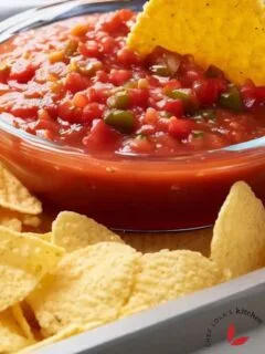 A fresh homemade restaurant-style salsa served in a bowl with corn chips