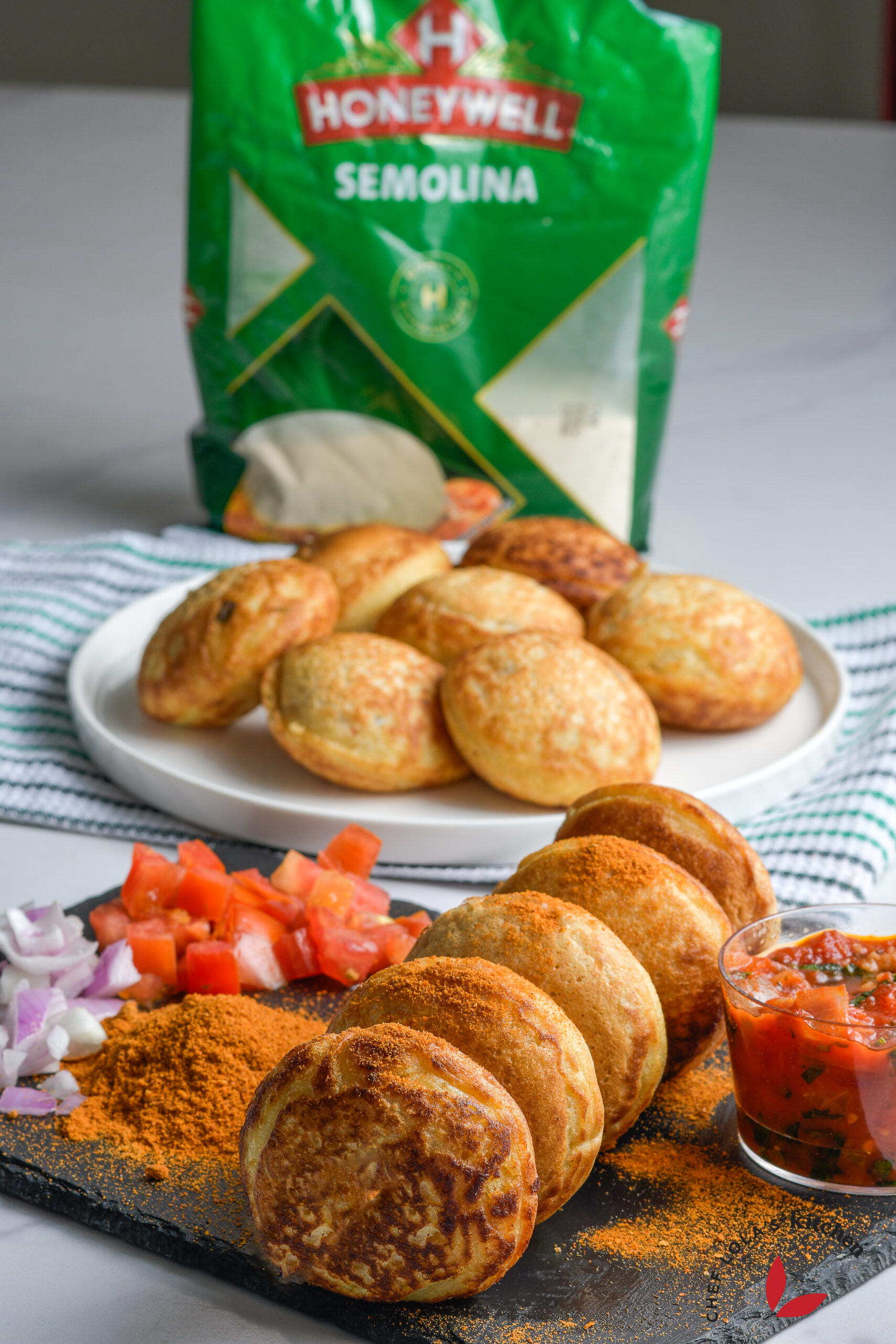 Golden, fluffy semolina masa stacked on a platter, served hot