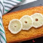 Freshly baked lemon semolina yoghurt cake topped with fresh lemon slices.