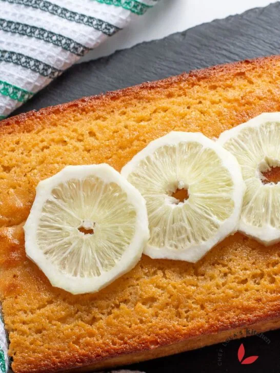 Freshly baked lemon semolina yoghurt cake topped with fresh lemon slices.