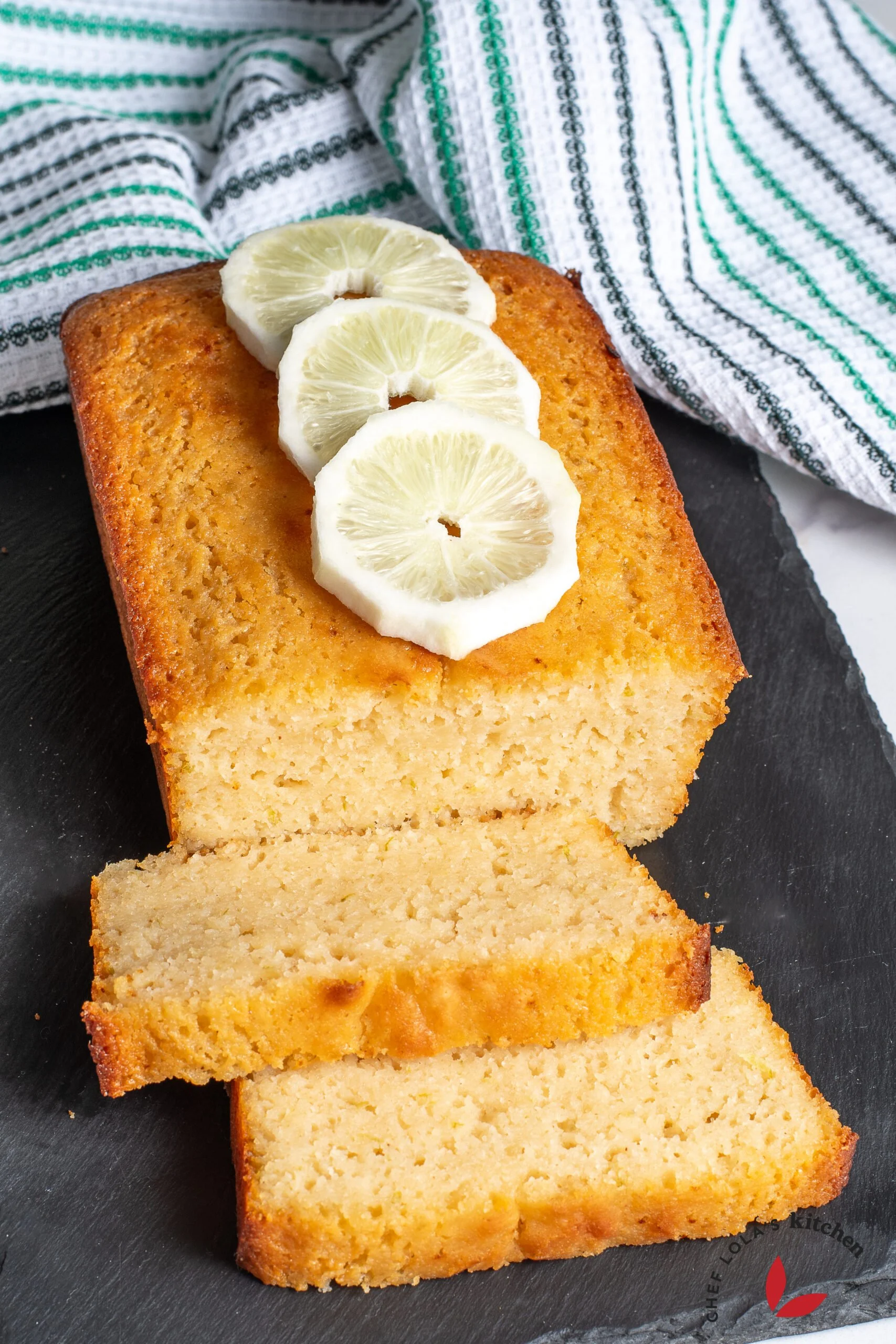Homemade lemon semolina yoghurt cake, sliced and ready to serve.