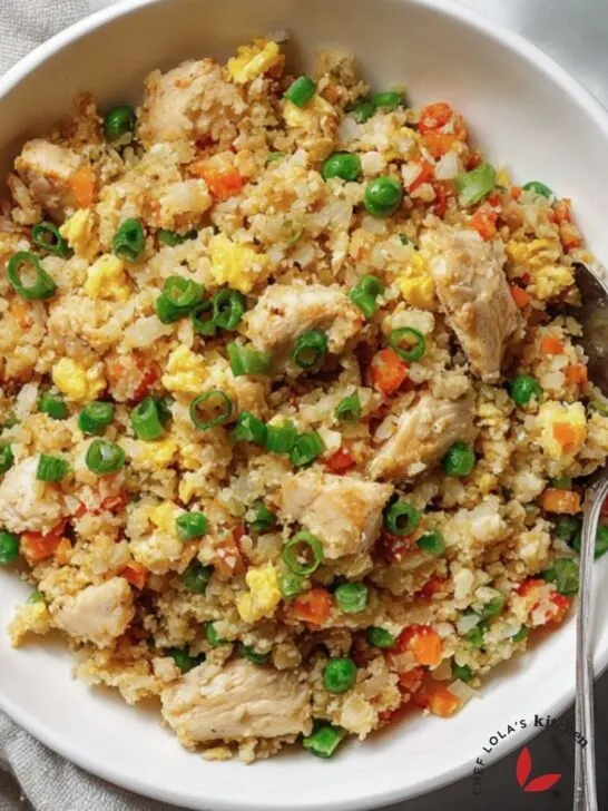 Healthy cauliflower chicken fried rice recipe with vegetables and eggs.