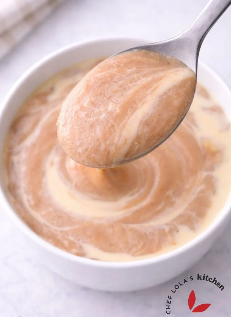 Close-up of freshly prepared Ogi in a white bowl, showing its soft, silky texture.