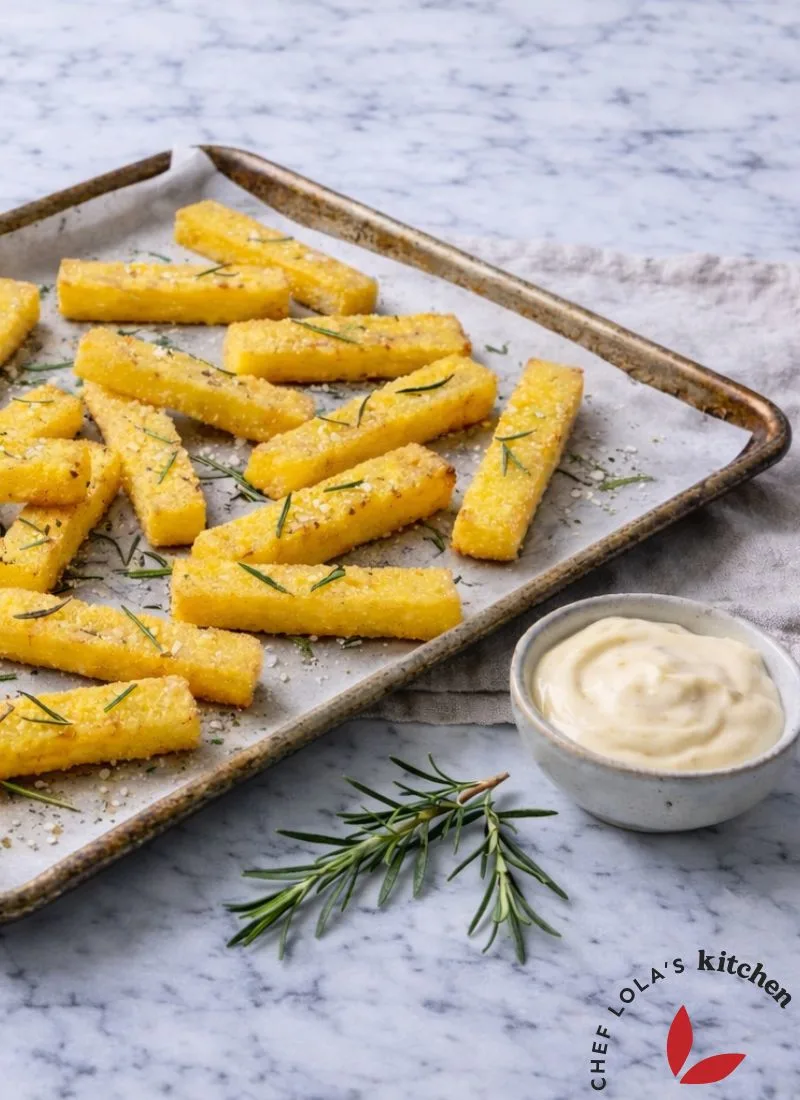 Crispy polenta fries garnished with herbs