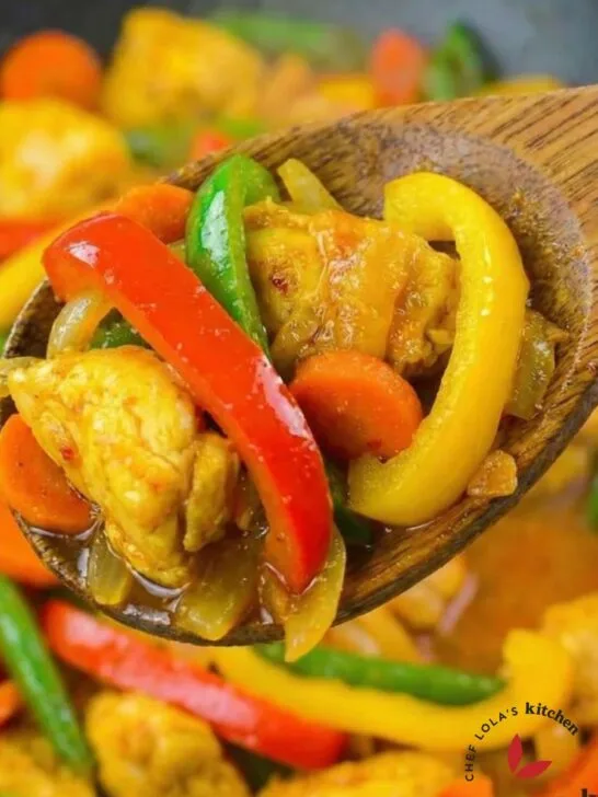 Stir-fried chicken with mixed vegetables coated in glossy sauce