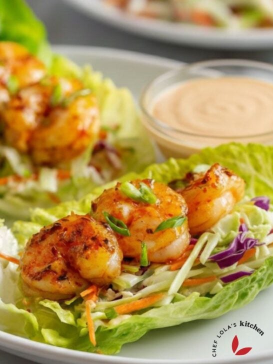 Fresh lettuce cups stuffed with sautéed shrimp and colorful toppings.