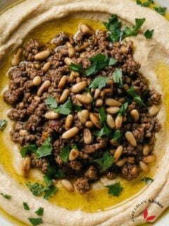 Fresh hummus with parsley garnish and olive oil